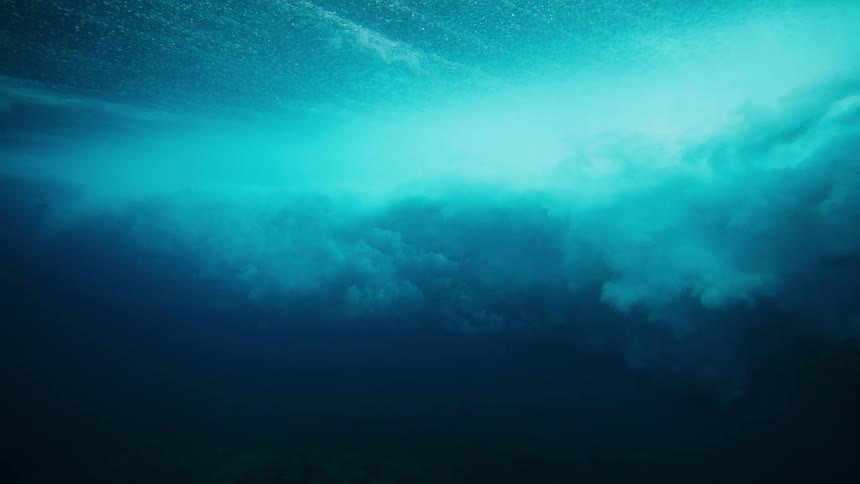 Wave with foam and force passing through the ocean