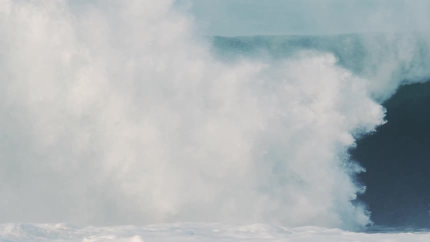Man surfing a large tubular wave