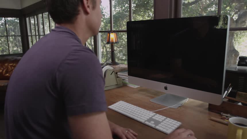 A man works at a computer