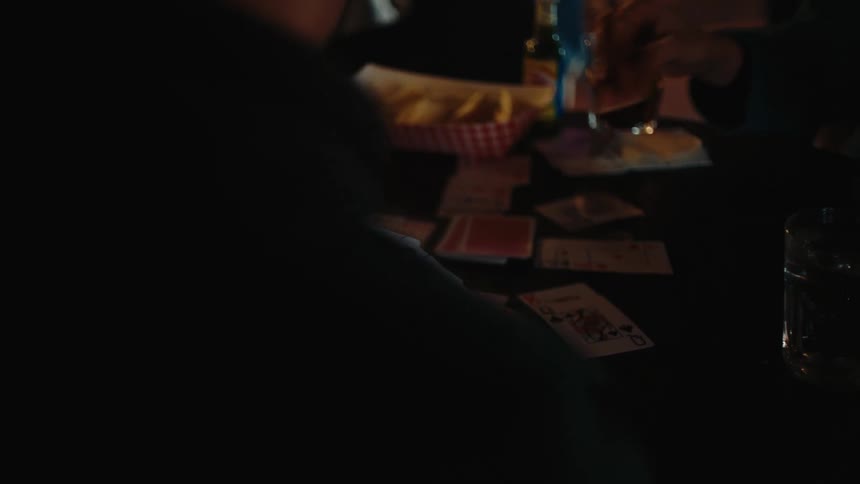 A footage of people playing a card game
