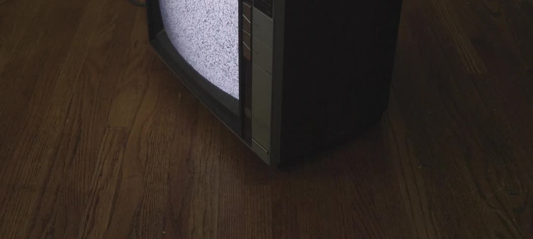 Tv flickering static on a hardwood floor