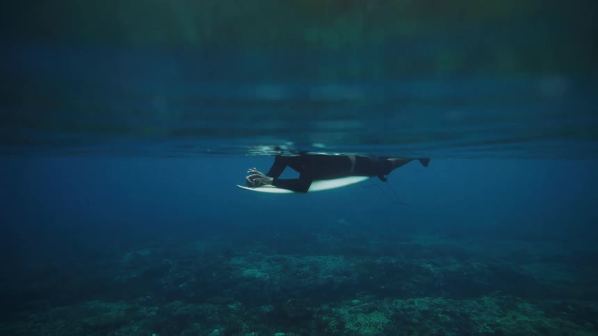A footage of a surfer underwater