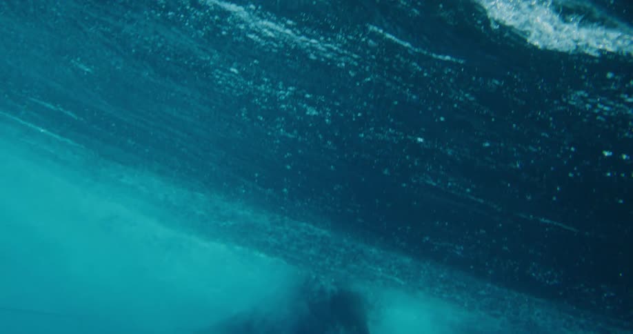 Surfer missing a tubular wave