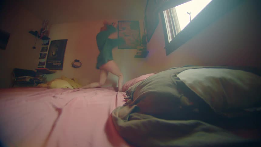 Woman on the bed dancing