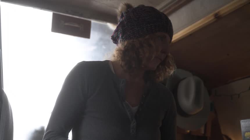 Woman inside a boat cabin talking