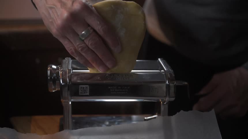 Pair of hands preparing bread dough