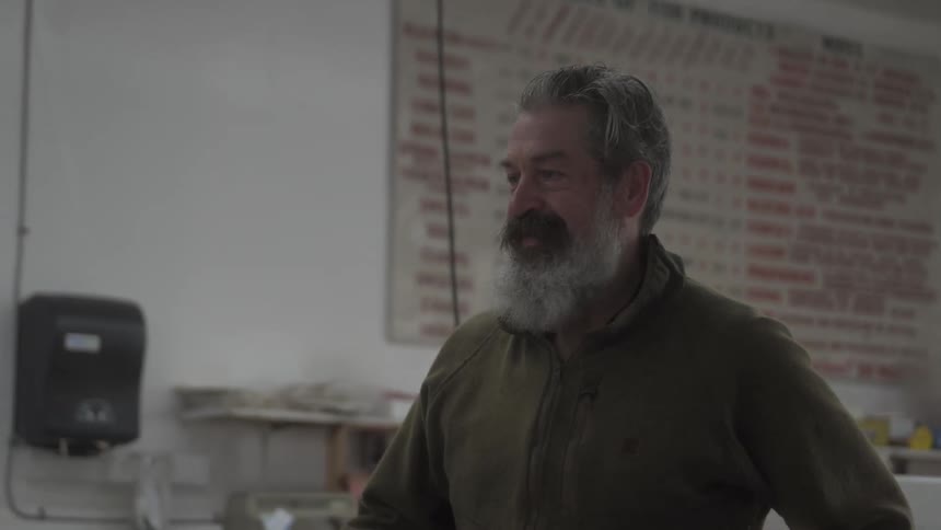 A footage of a man buying from a store