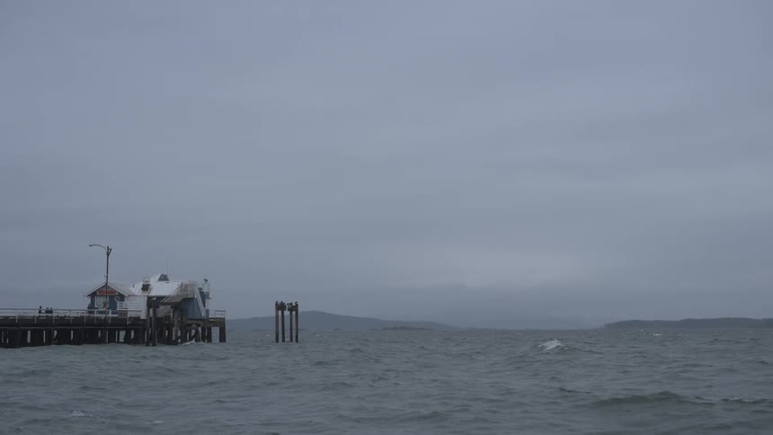 Heavy clouds are over the pier