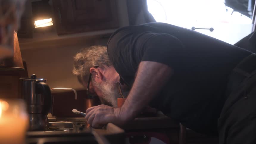 Bearded man brushing his teeth