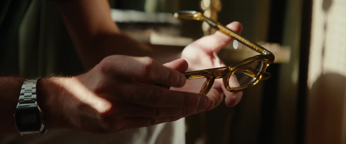 Pair of hands of a man holding glasses