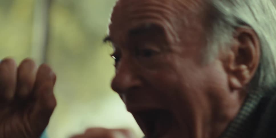 Two men are really happy as they laugh and celebrate