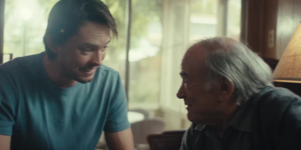 Two men are having a conversation on a video call