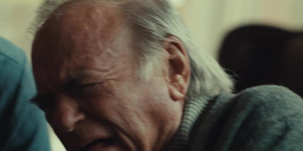 A man yells and clenches his fists