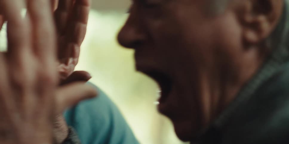 Elderly man and a young man vibrating energetically happily
