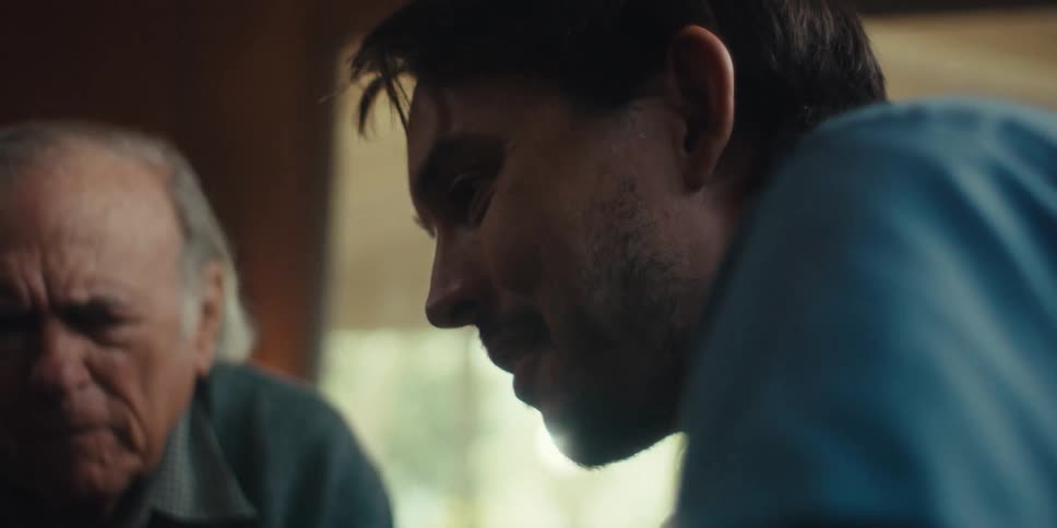 Young man and elderly man talking together