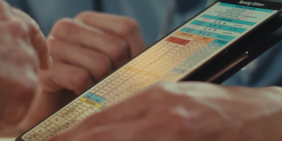Hands of two people interacting with numbers in a document