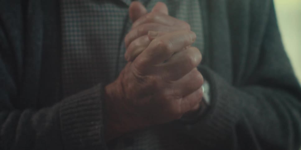 Elderly man talking happily