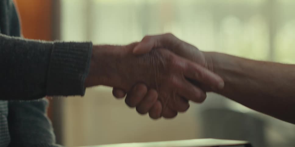 Two men are shaking hands