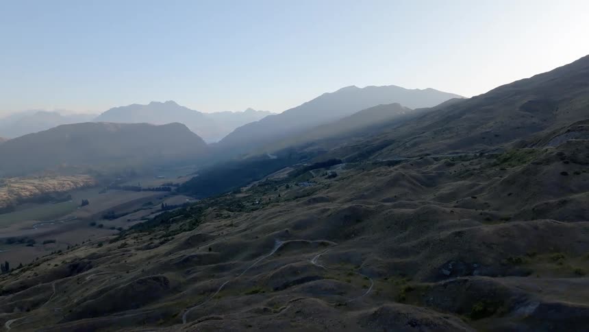 Aerial panorama of mountain ranges at dawn