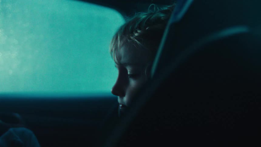 Child sleeping inside a car