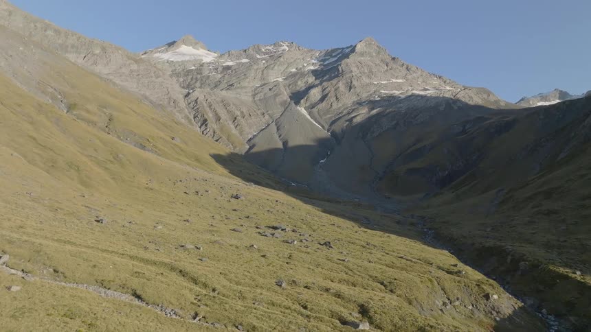 A little snow is left on the top of a mountain as spring arrives