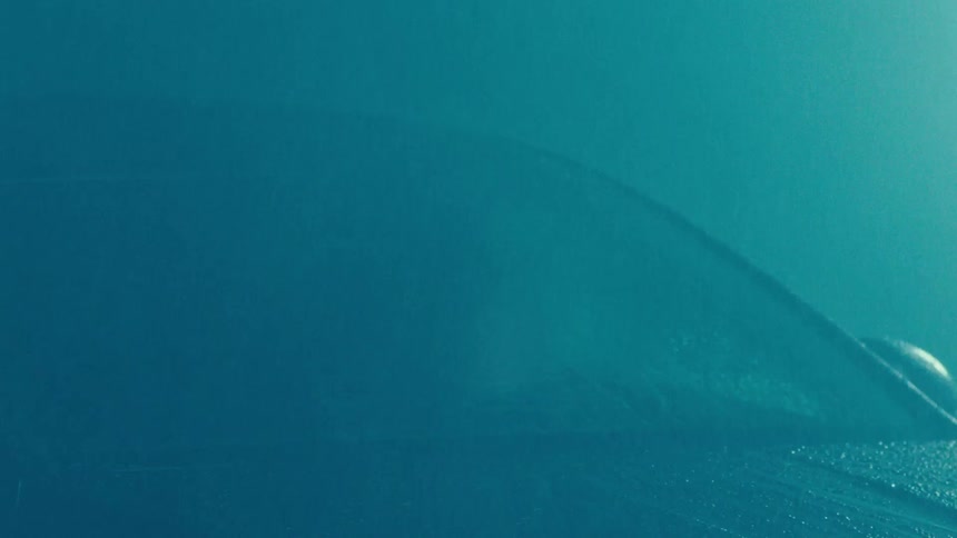 Mysterious view of a car with rain falling
