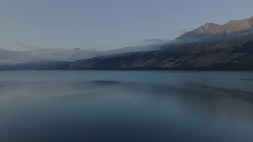 Fog is on the mountains by the water