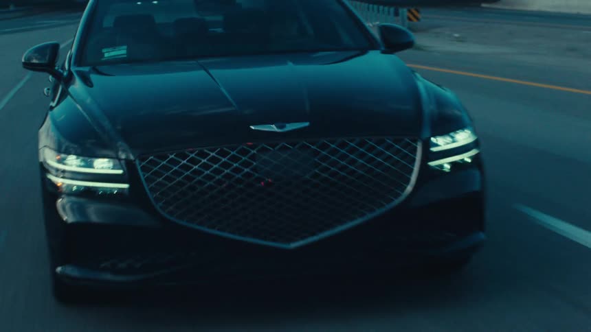 Black sedan car moving on the road
