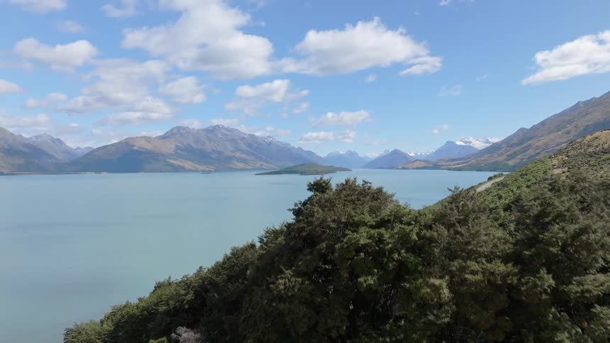 A large lake is surrounded by mountains