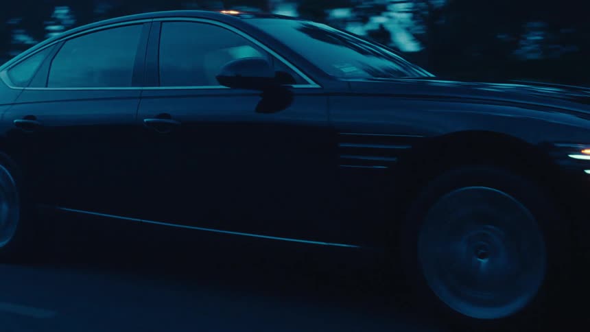 A car changes lanes on the highway