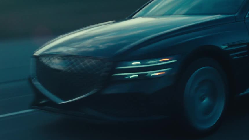 Black car speeding down a highway