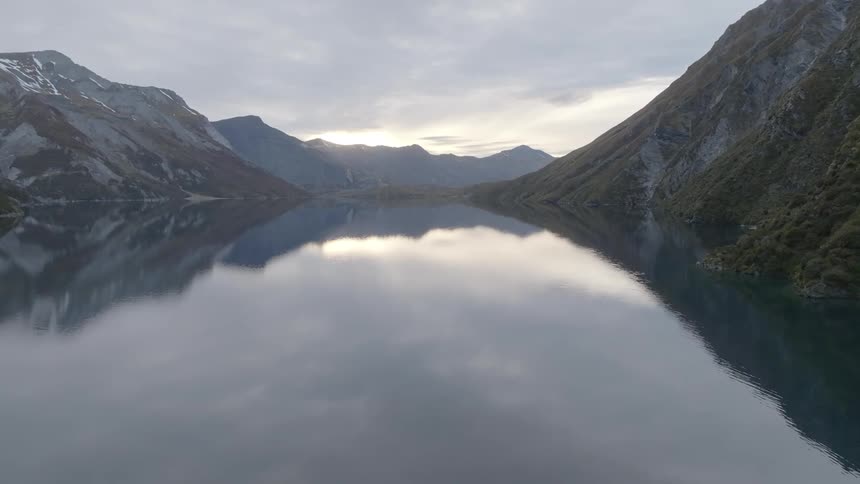 A lake is at the top of the mountain