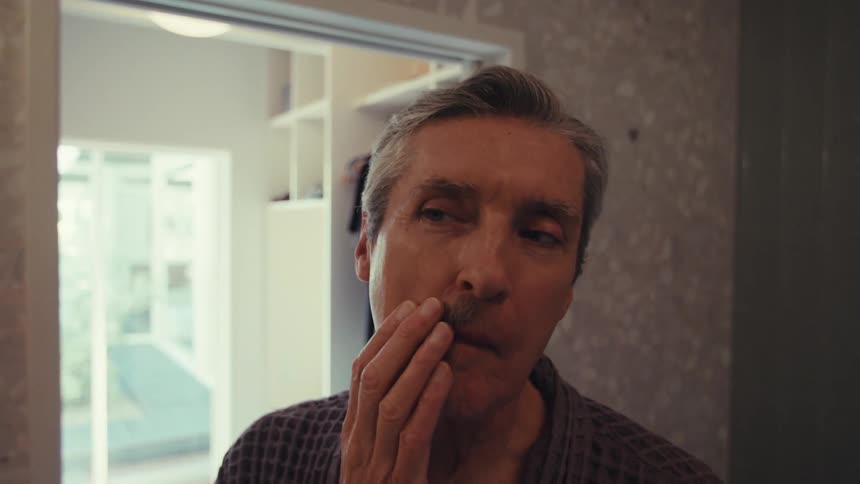 Man shaving in the bathroom