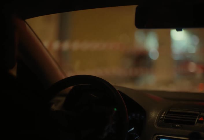 A footage of a person driving a car
