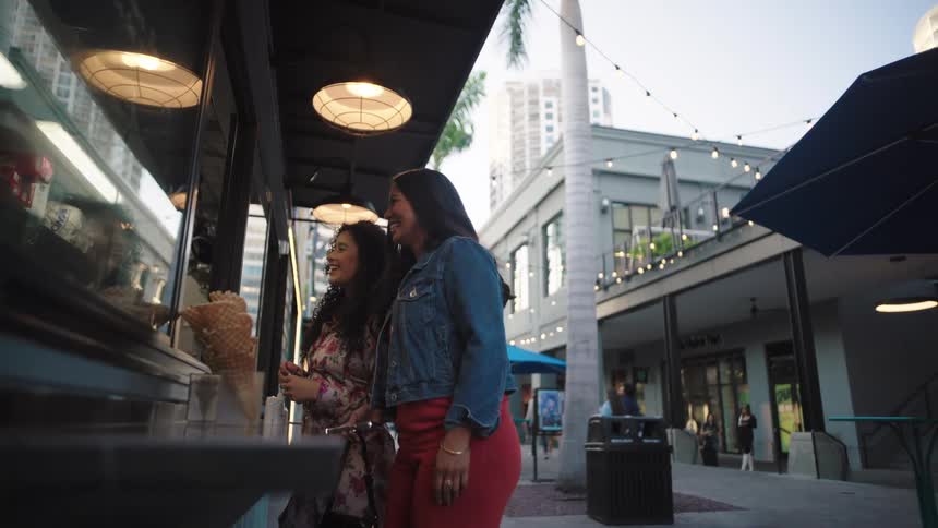 A footage of ladies standing outside a store