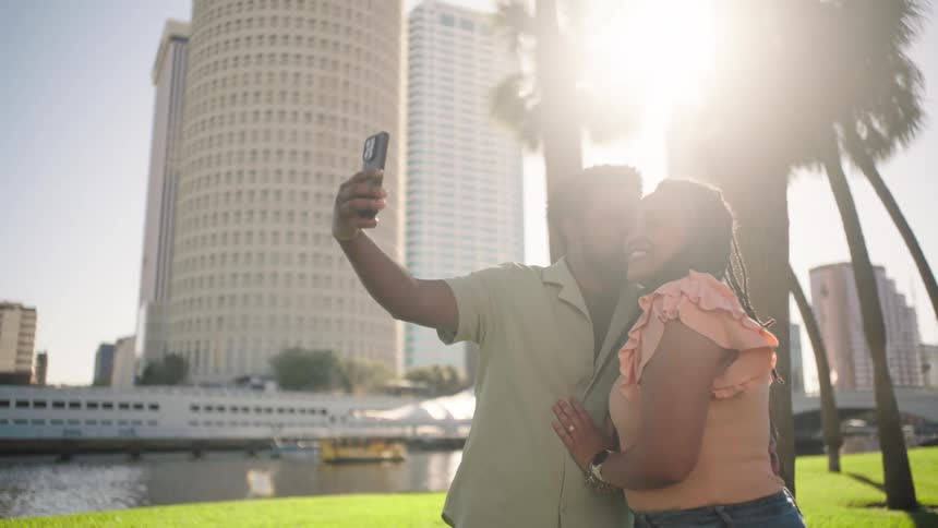 A footage of a woman and a man taking a selfie