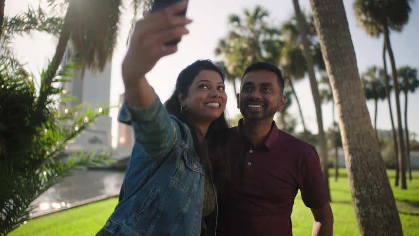 Happy couple taking selfie