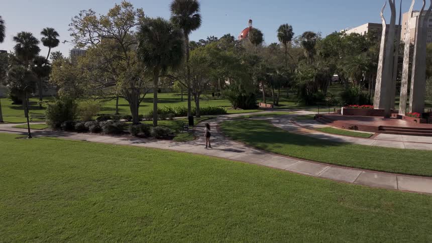 Woman rollerblading through a square during a day