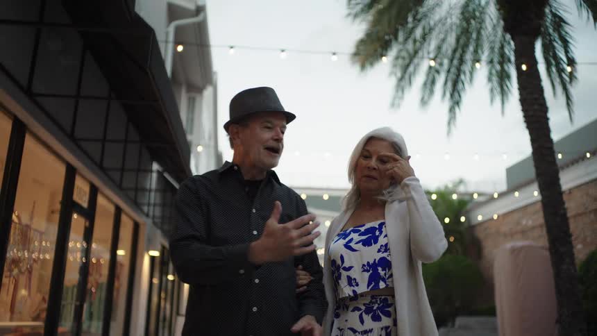 A couple are talking and going on a stroll