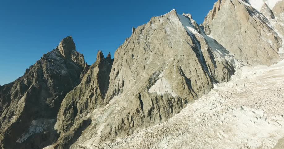 The peak of the mountain touches the clear skies