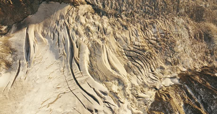Aerial view of cliffs and natural erosion marks on mountains