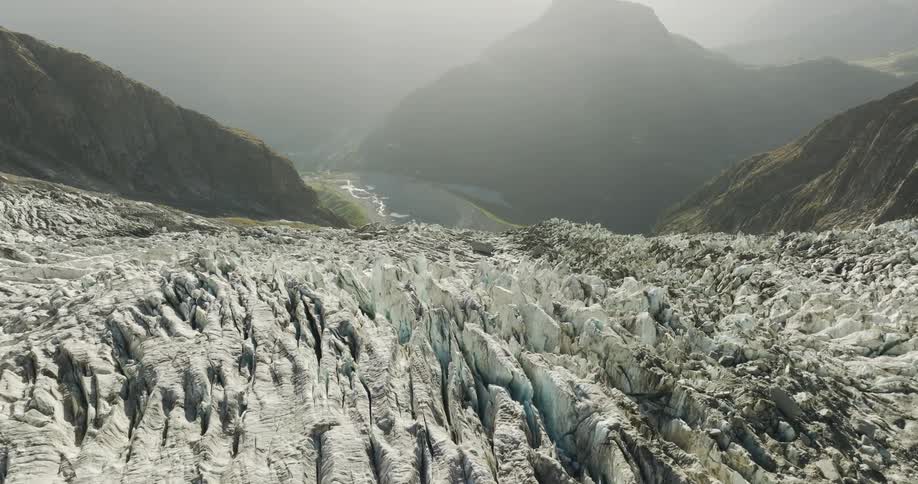 A small valley surrounded by rocky mountains