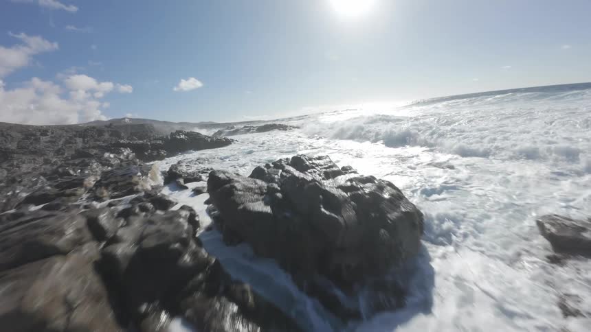Flying over a rocky coast