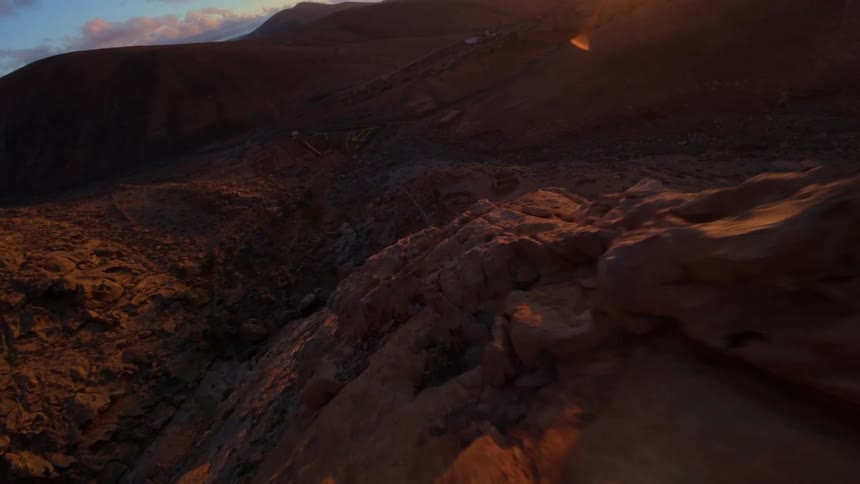 The sun is rising on the long mountain range