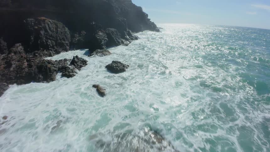 Aerial view of a rocky coastline by the sea
