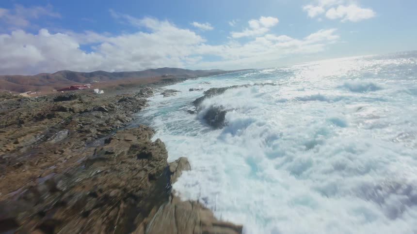 Large waves crash on the rocks