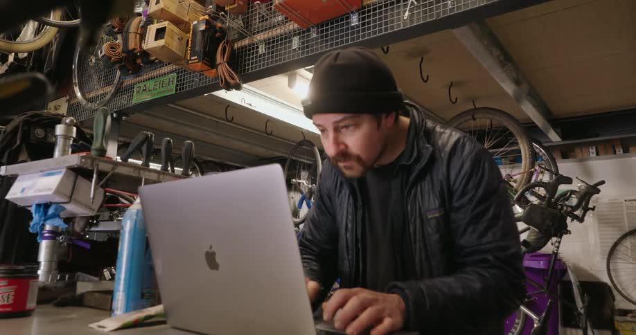 Concentrated man working on a laptop