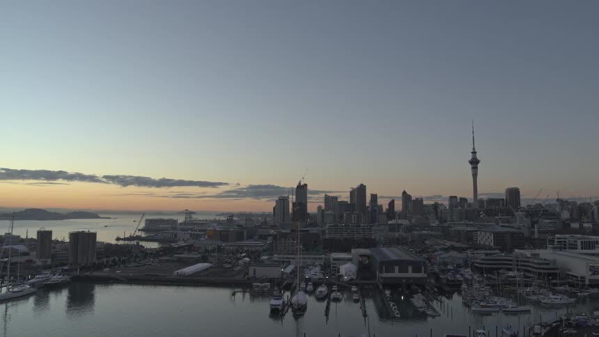 Aerial panorama of a seaside metropolis at dawn