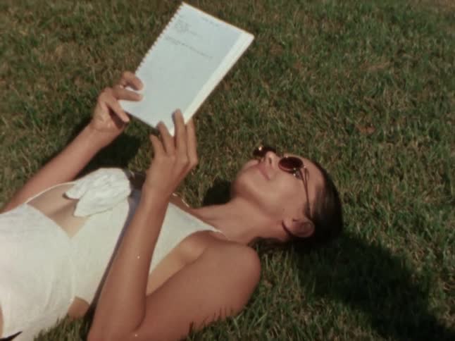 A footage of a lady reading