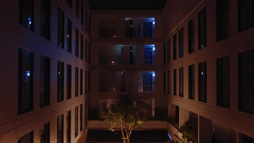 The apartment building has many windows